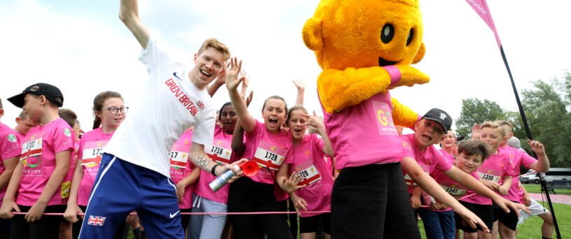 Tom Bosworth with runners and Go Run For Fun mascot | Tees Valley Combined Authority