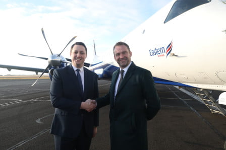 Tees Valley Mayor Ben Houchen stood with Tony Burgess Managing Director Eastern Airways in front of Eastern aircraft