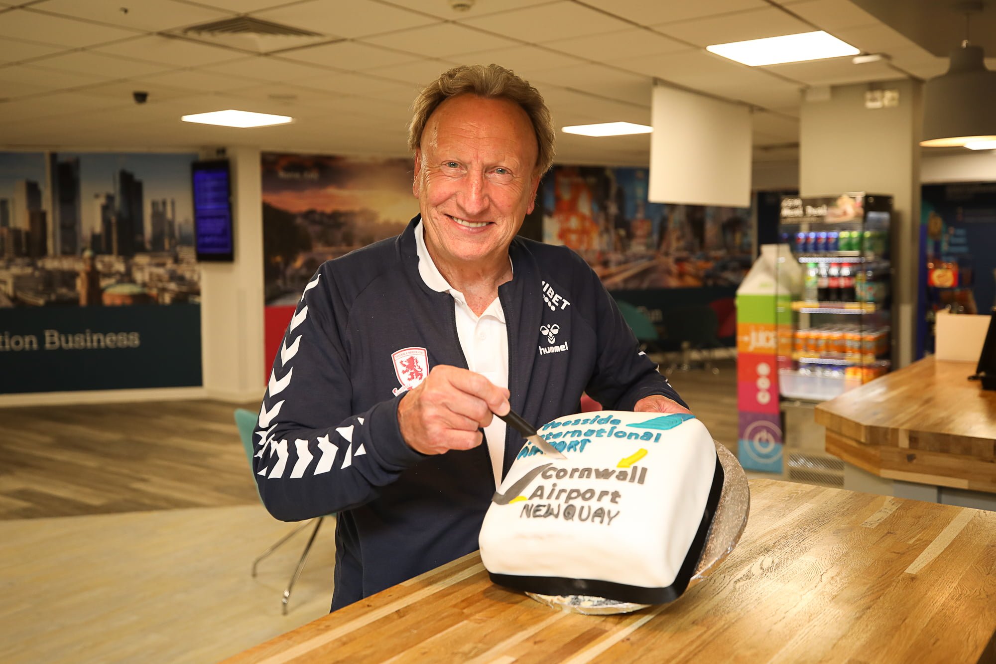 Neil Warnock cutting the Newquay route cake
