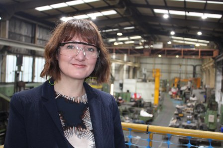 Picture of Helen Cameron-Clarke who is Managing Director of Dormor Machine. She is standing at the firm's Cargo Fleet Factory on a platform overlooking the site.